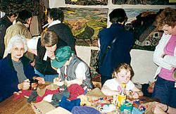 Visitors making rag rugs at the exhibition